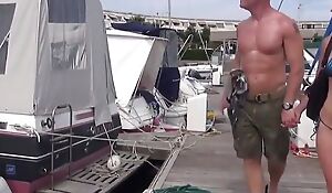 Sailboat day for a swinger couple with a man banging a young stunning blonde while his wife is watching