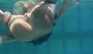Blonde Feher with big firm breast underwater