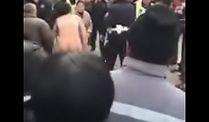 Chinese woman pushed sturdiness not call attention to of pants fighting with cops