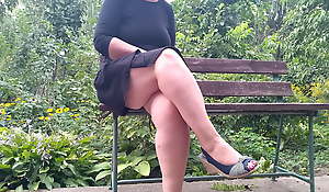Lustful MILF pissing while sitting first of all a bench
